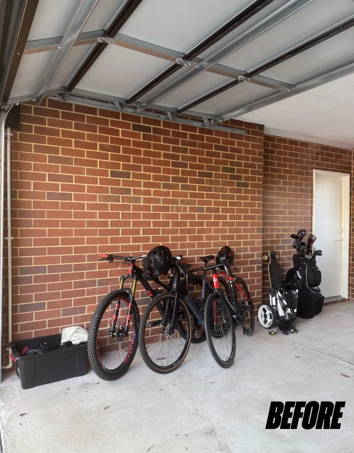 Garage before Best Bike Storage install, bikes leaning against the wall